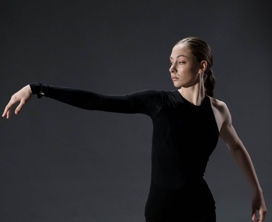 A person performing a yoga stretch, showcasing flexibility and focus.